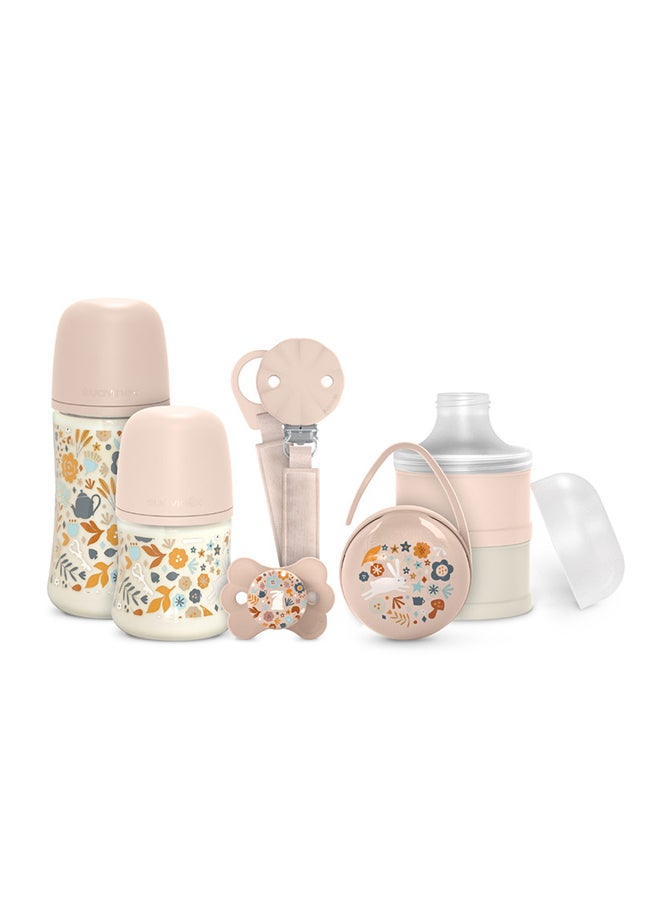 SUAVINEX طقم هدايا ترحيب بالطفل مكون من 5 قطع للمواليد الجدد، زجاجات رضاعة، مصاصة، حامل مصاصة وموزع حليب بودرة - وردي - Image 1