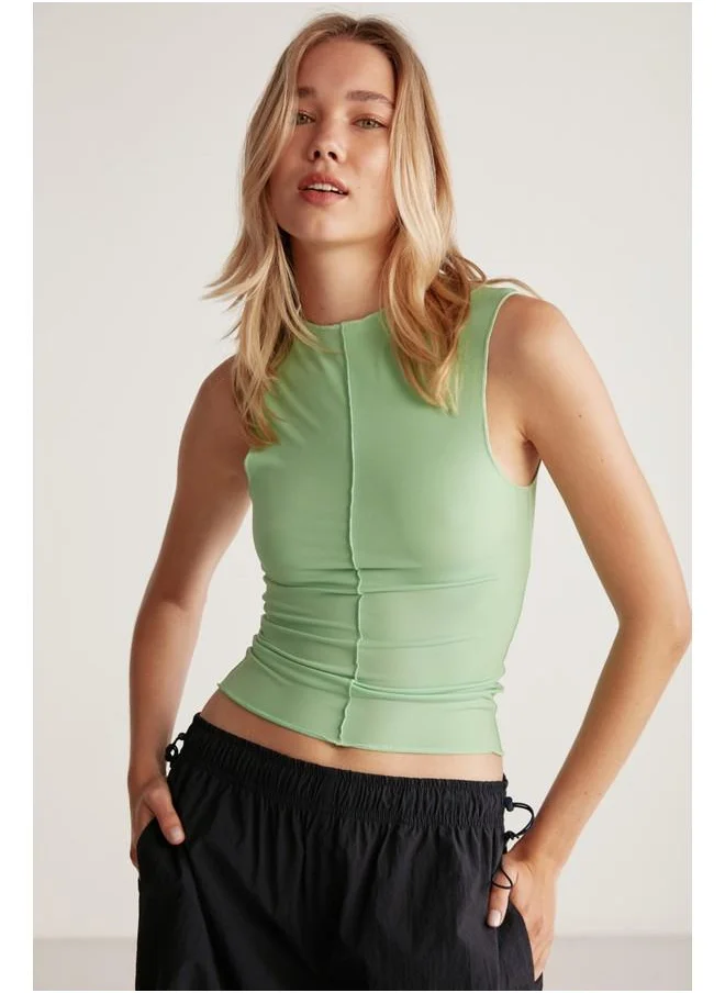 GRIMELANGE Grimelange Ginny Women's Sandy Stretch Fabric Open Hem Bodycon Sleeveless Green Blouse