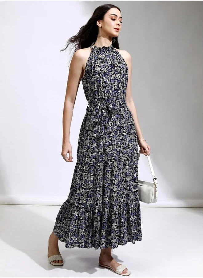 طوكيو توكيز All-Over Floral Print Halter Neck A-Line Maxi Dress by Styli