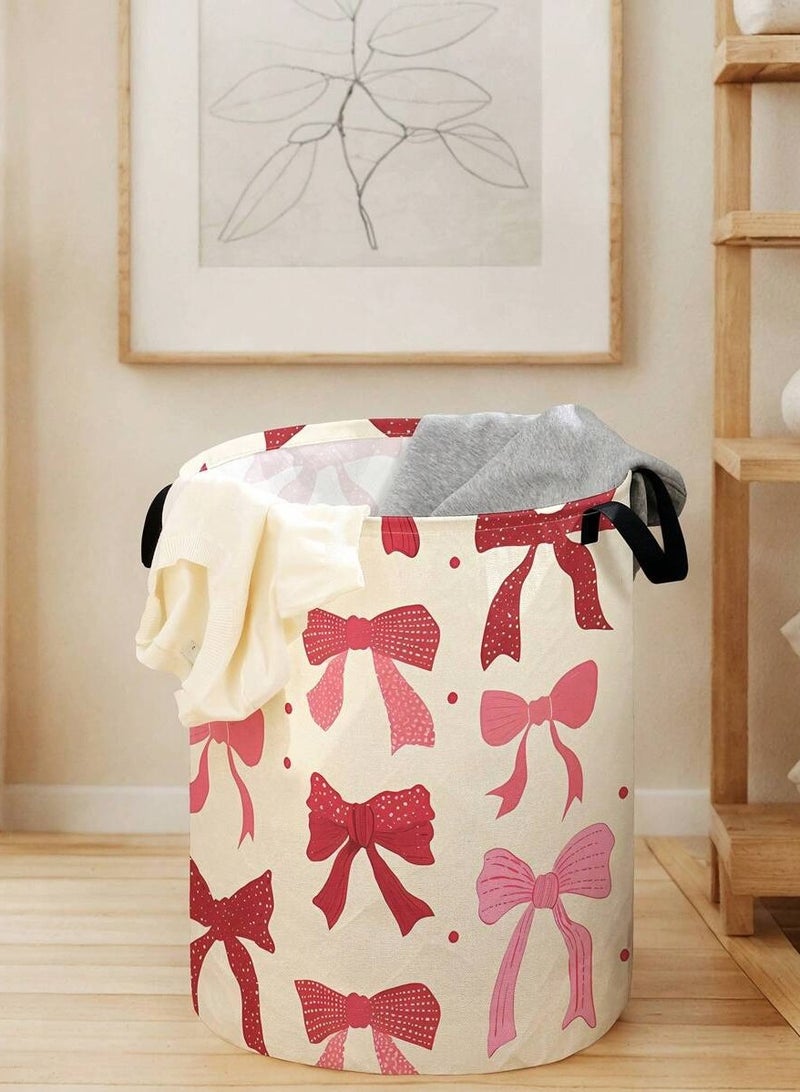 سلة غسيل ملابس قماشية مزينة بفيونكات وردية وحمراء سعة تخزين عملية مقاس 48×38 سم مع مقابض للحمل مناسبة لغرفة النوم والغسيل - Image 1