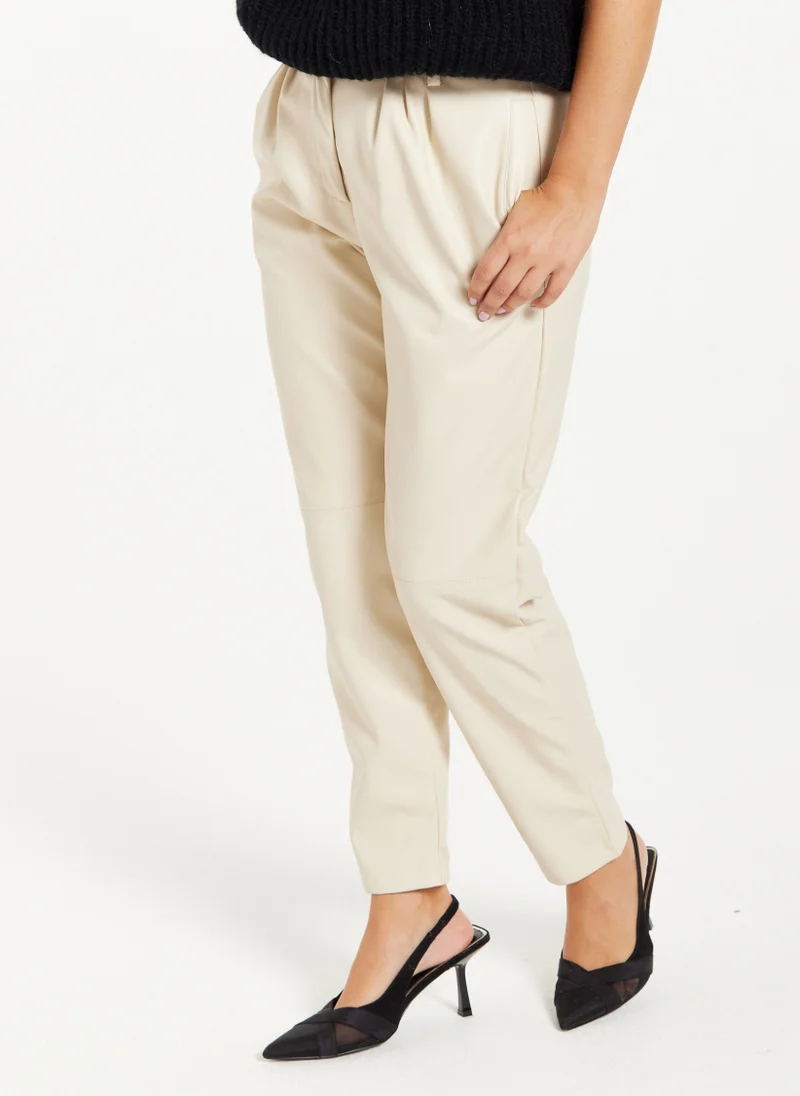 Liquorish Tapered Leather Look Trousers in Cream
