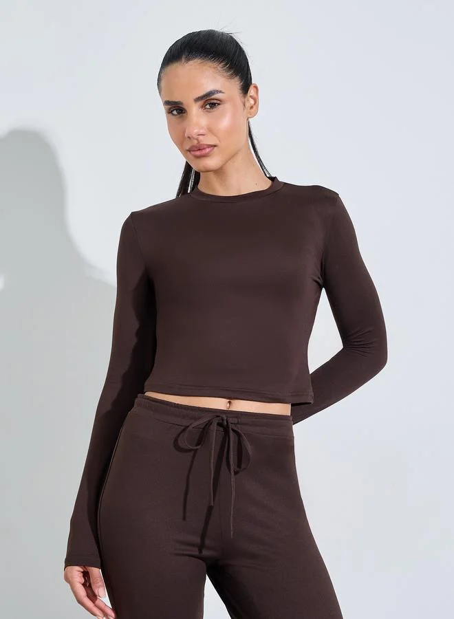 Styli Active  Brown Solid Long Sleeves Crop Top And Flared Leggings Active Set for Women | Best Price UAE