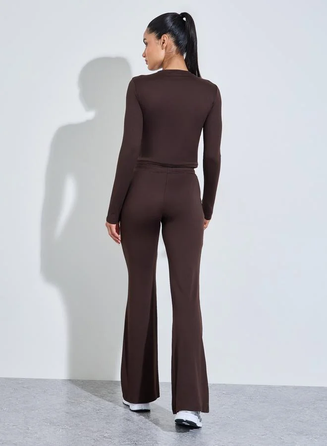 Styli Active  Brown Solid Long Sleeves Crop Top And Flared Leggings Active Set for Women | Best Price UAE