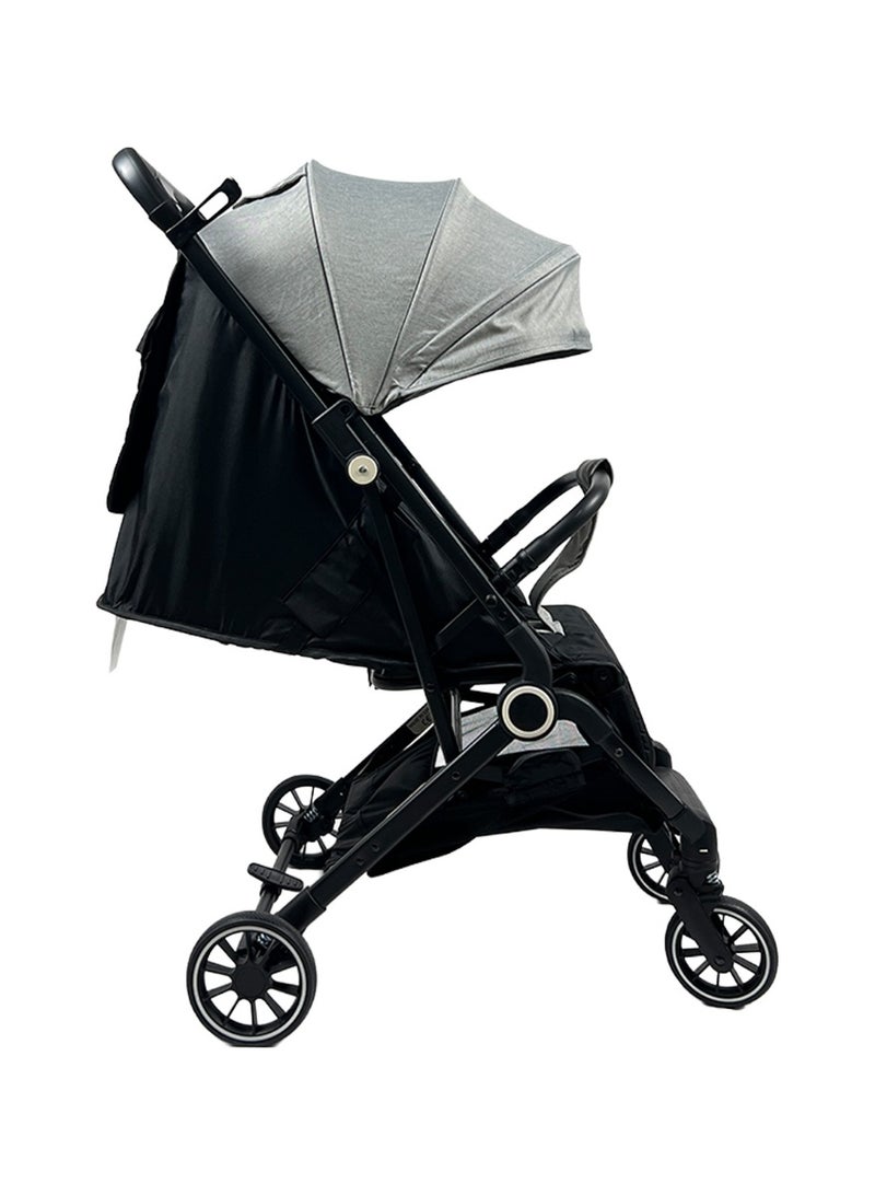Foldable and lightweight baby stroller with flexible wheels and a protective canopy, gray color - Image 1