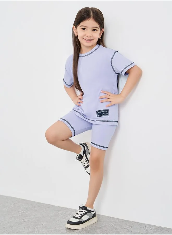 Styli Styli Oversized Badge Detail T-Shirt and Cycle Shorts Set