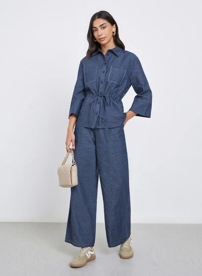 ستايلي قميص دنيم سادة بأكمام ثلاثة أرباع وخصر برباط