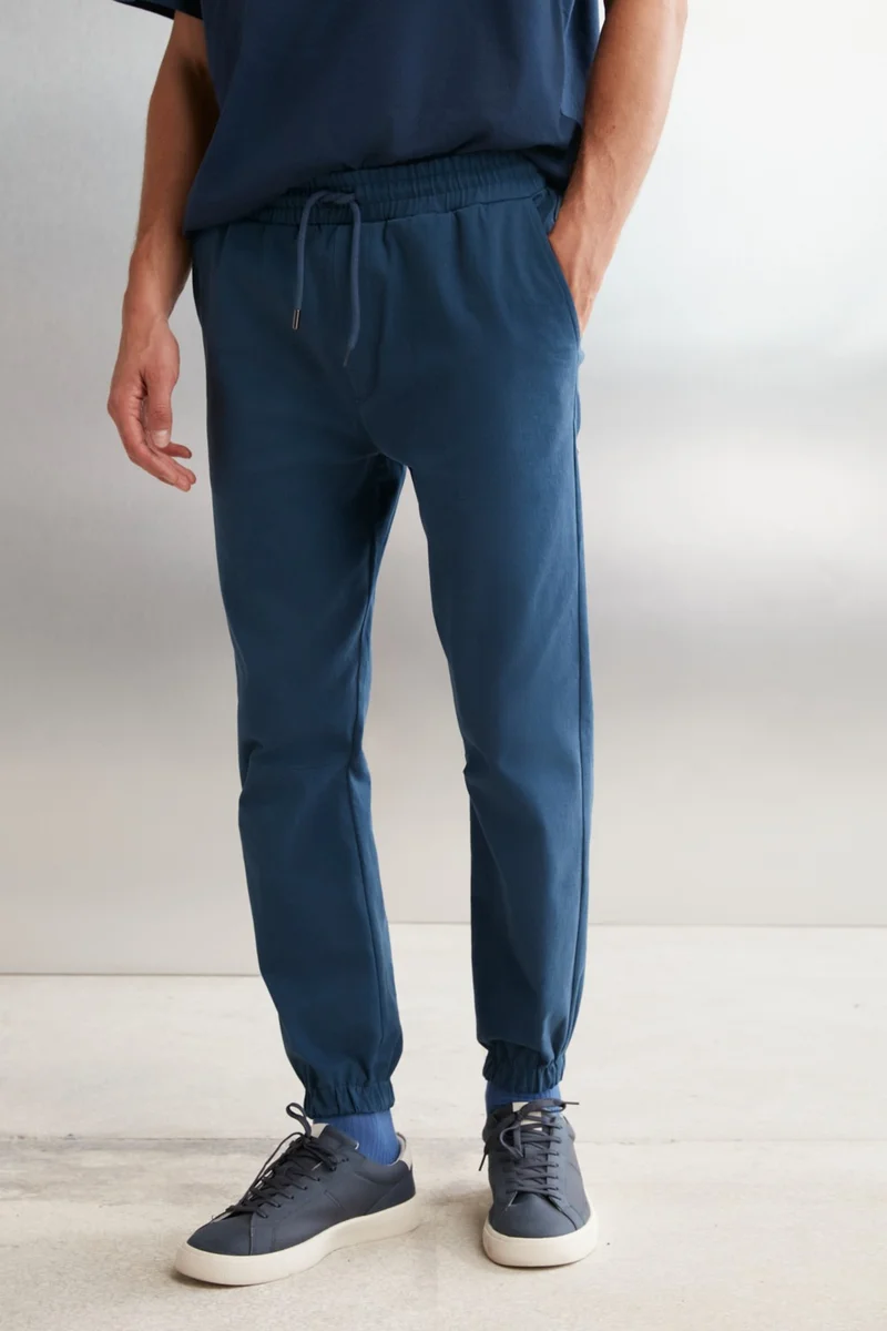 GRIMELANGE Jakob Men's Woven Washed 4 Pocket Thick Textured Elastic Leg Blue Trousers