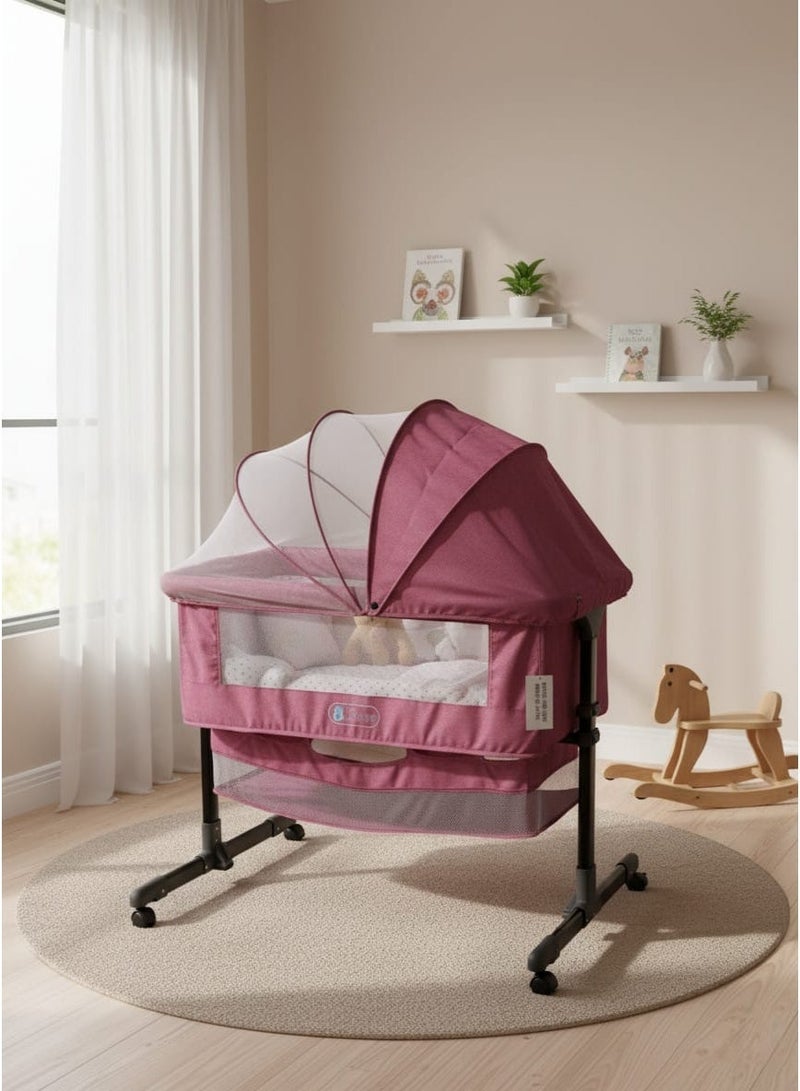 متجر ان زون سرير أطفال حديث الولادة من بيبي زون قابل لتعديل الارتفاع مع مسند رأس قابل للتعديل، جانبي قابل للفتح، شبكة ناموسية قابلة للفصل، ورف سفلي ومرتبة ناعمة بعجلات دوارة 360 درجة، للرضع حديثي الولادة-زهري - Image 1