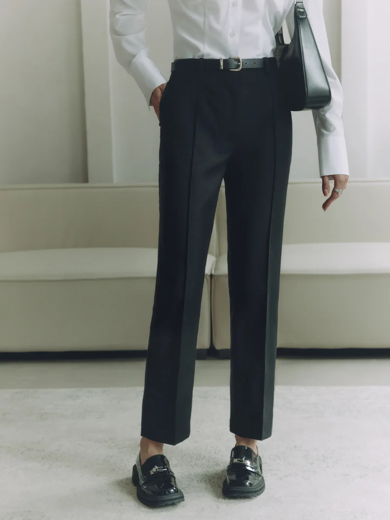Cropped trousers with a crease and eco-leather belt