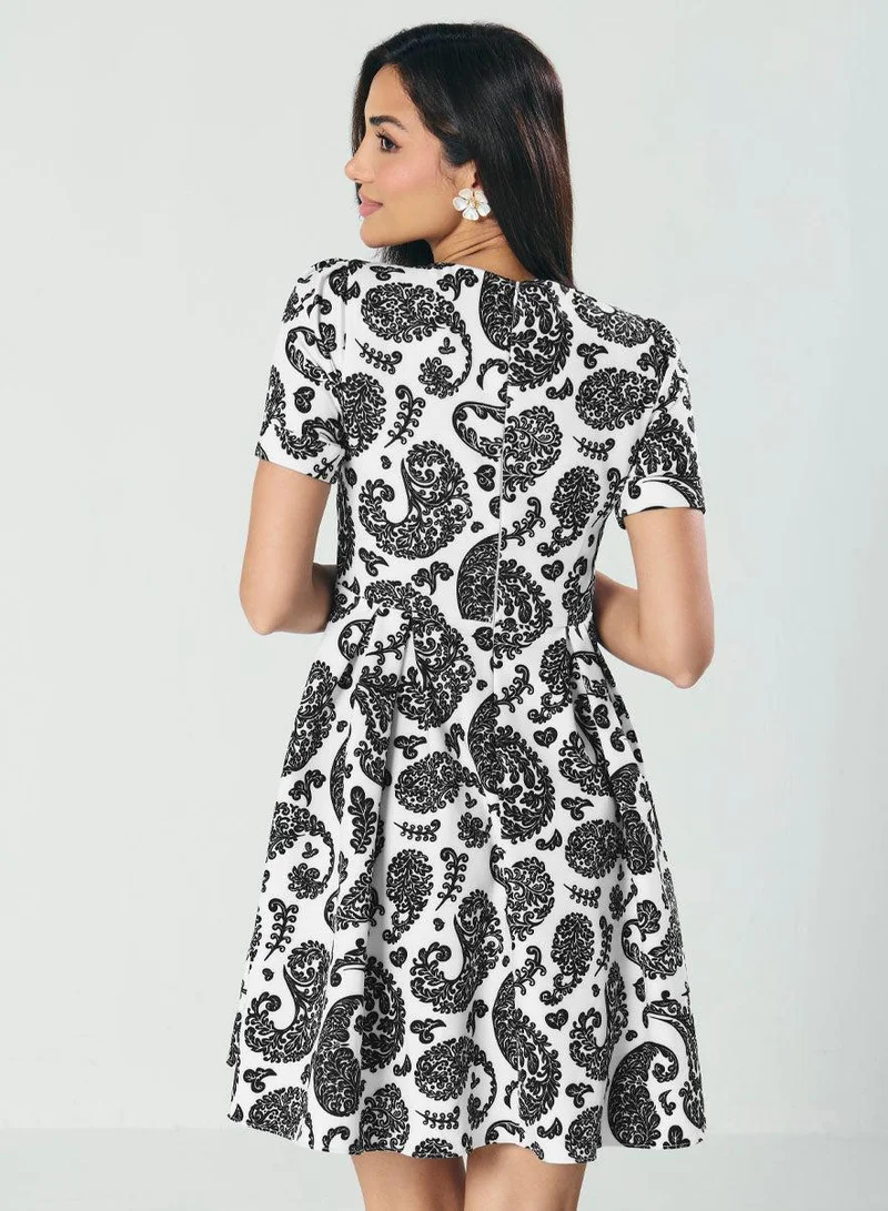 زجزاج فستان ميدي مطبوع بكسرات واسع