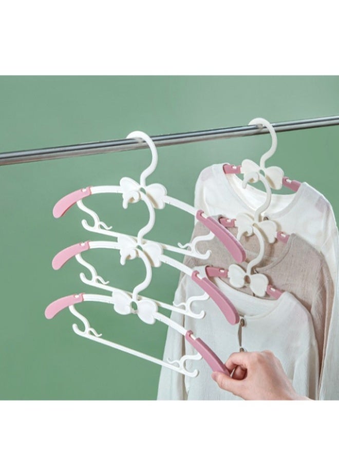 INSIJAM 20pcs Baby Hangers for Kids Clothes Closet Non-Slip Adjustable Infant Baby Coat Hangers Extendable Toddler Hanger for Children Girl Non-Slip Pink Nursery Hanger with White Bow - Image 1