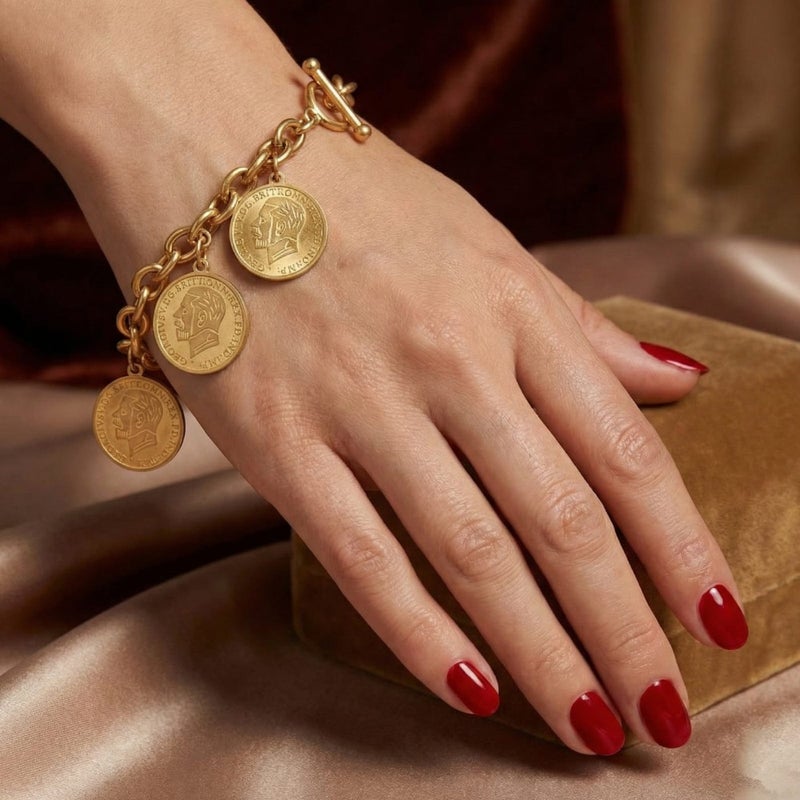An elegant gold bracelet made of rust-resistant stainless steel, with a classic chain design adorned with three elegant coins, and an adjustable clasp to suit you. - Image 2