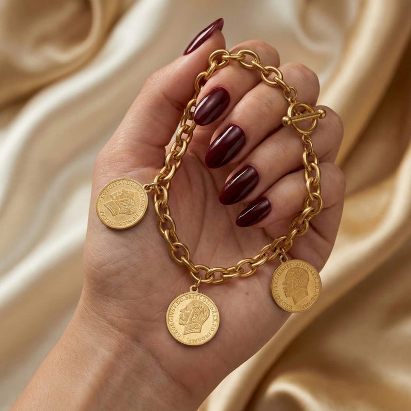 An elegant gold bracelet made of rust-resistant stainless steel, with a classic chain design adorned with three elegant coins, and an adjustable clasp to suit you. - Image 3