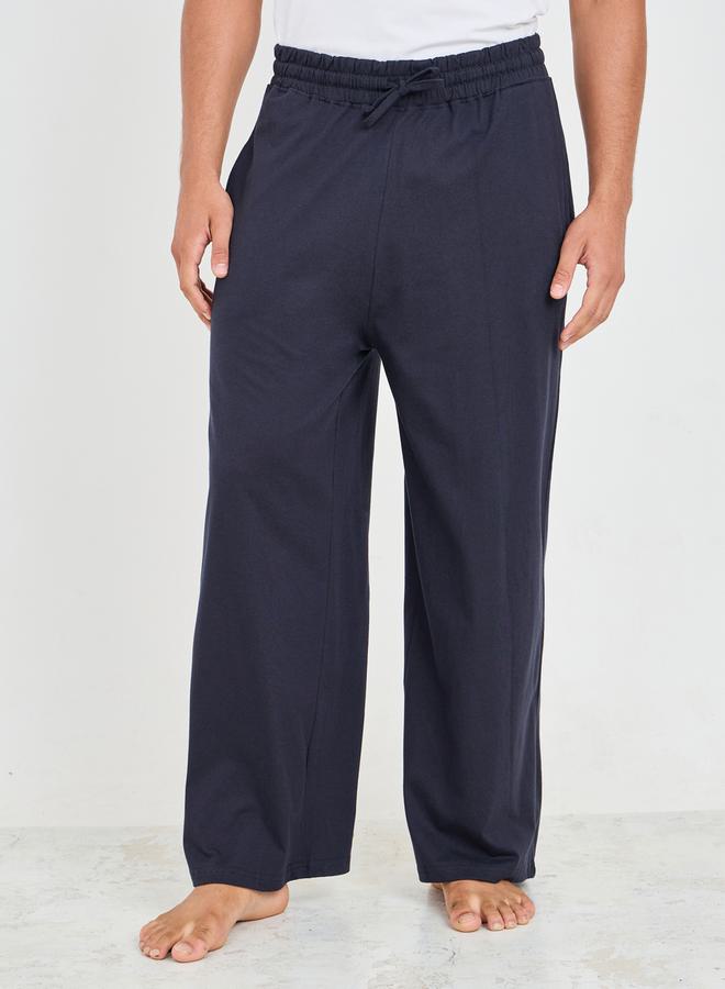ستايلي بنطلون بيجاما واسع الساق بتفاصيل جيب وحزام خصر برباط - Image 1