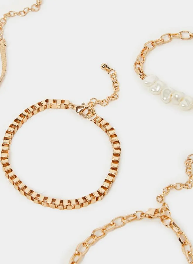 Styli  Styli Set of 8 - Gold Tone Layered Bracelets for Women | Best Price UAE