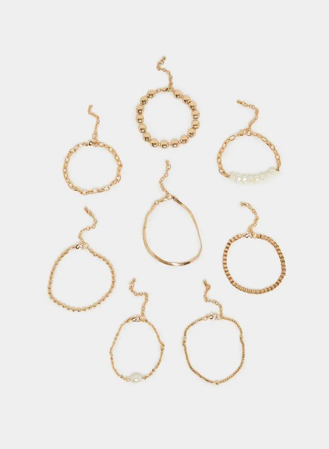 ستايلي طقم منسق من 8 أساور بطبقات بلون ذهبي