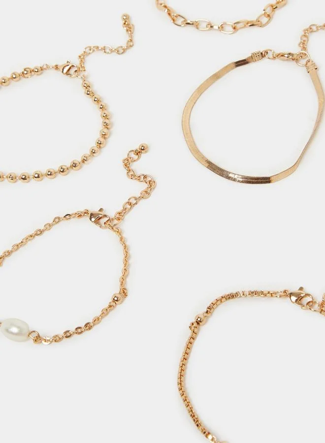 Styli  Styli Set of 8 - Gold Tone Layered Bracelets for Women | Best Price UAE