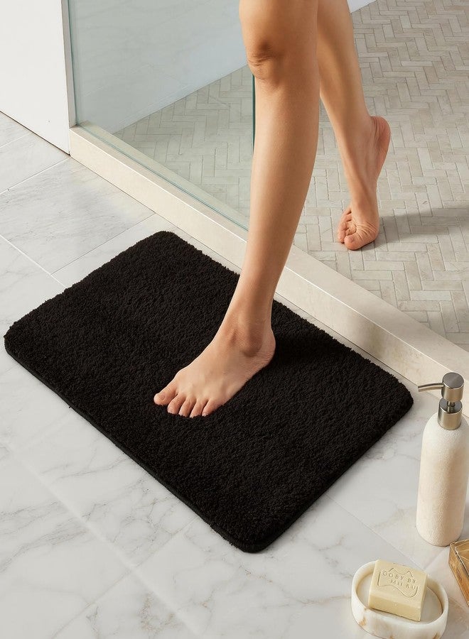 TYUU Black Bathroom Rug, Ultra Soft Bath Rugs Non Slip Washable, Super Absorbent Quick Dry Small Bath Mat with Rubber Backing for Bathroom Floor, Shower, or Sink, Black 16" x 24" - Image 1