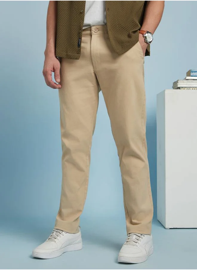 Dennis Lingo Trendy Beige Straight Fit Chinos for Men featuring subtle back pocket detailing, crafted from a breathable and stretchable cotton-lycra blend for daily comfort.