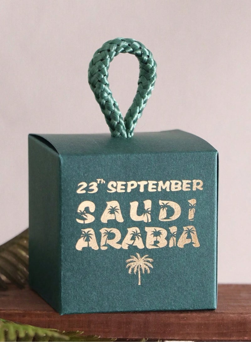 Generic Saudi National Day Decorations 5 small green boxes with a twisted fabric ribbon printed with the date of the National Day for giving gifts and distributions during National Day celebrations - Image 1