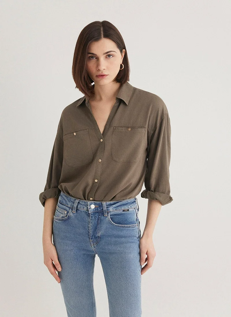 مافي قميص بيج