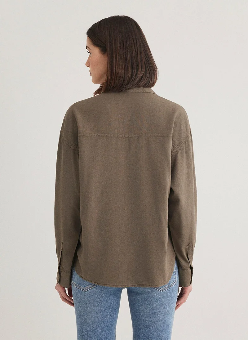 مافي قميص بيج