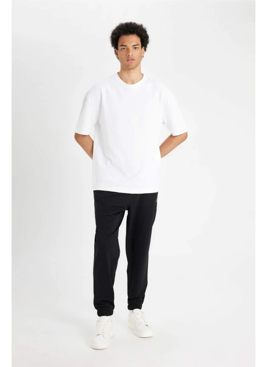 ديفاكتو Regular Fit Sweatpants with Pockets and Elastic Legs D4416AX24AU