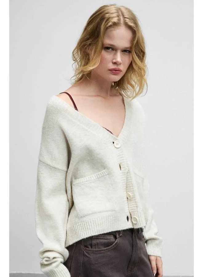 Grimelange ESENCIA Women's V-Neck Long Sleeve Sweater with Button Pocket, soft‑texture regular knit, ecru.