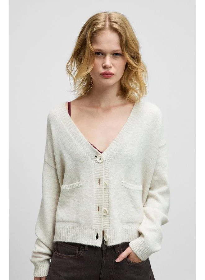 Grimelange ESENCIA Women's V-Neck Long Sleeve Sweater with Button Pocket, soft‑texture regular knit, ecru.