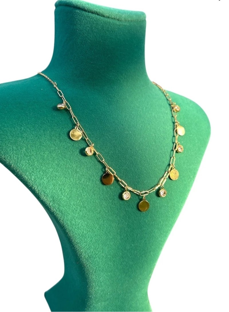 Luxuria A charming necklace crafted from gold-plated stainless steel. This design features a delicate pendant in the form of circular disc-shaped charms and clear gemstones, scattered on a modern chain, giving it a look that is both elegant and classic. - Image 2