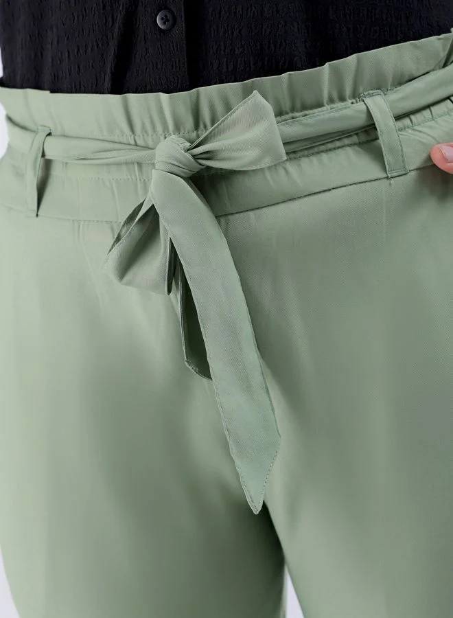 مرفوعة Women Slim Fit Solid Mid-Rise Elasticated Ruffle Waist Trousers