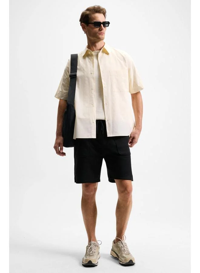 Grimelange GAUCI Men's Elastic Waist Side and Back Pocket Relaxed Black Shorts.