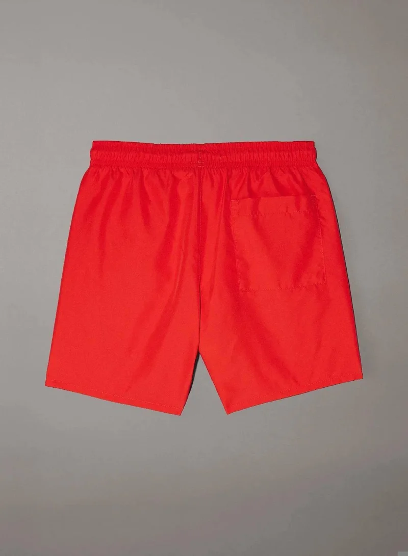 Calvin Klein Jeans Flaming Chili Boys Swim Shorts - Intense Power for Men | Best Price UAE