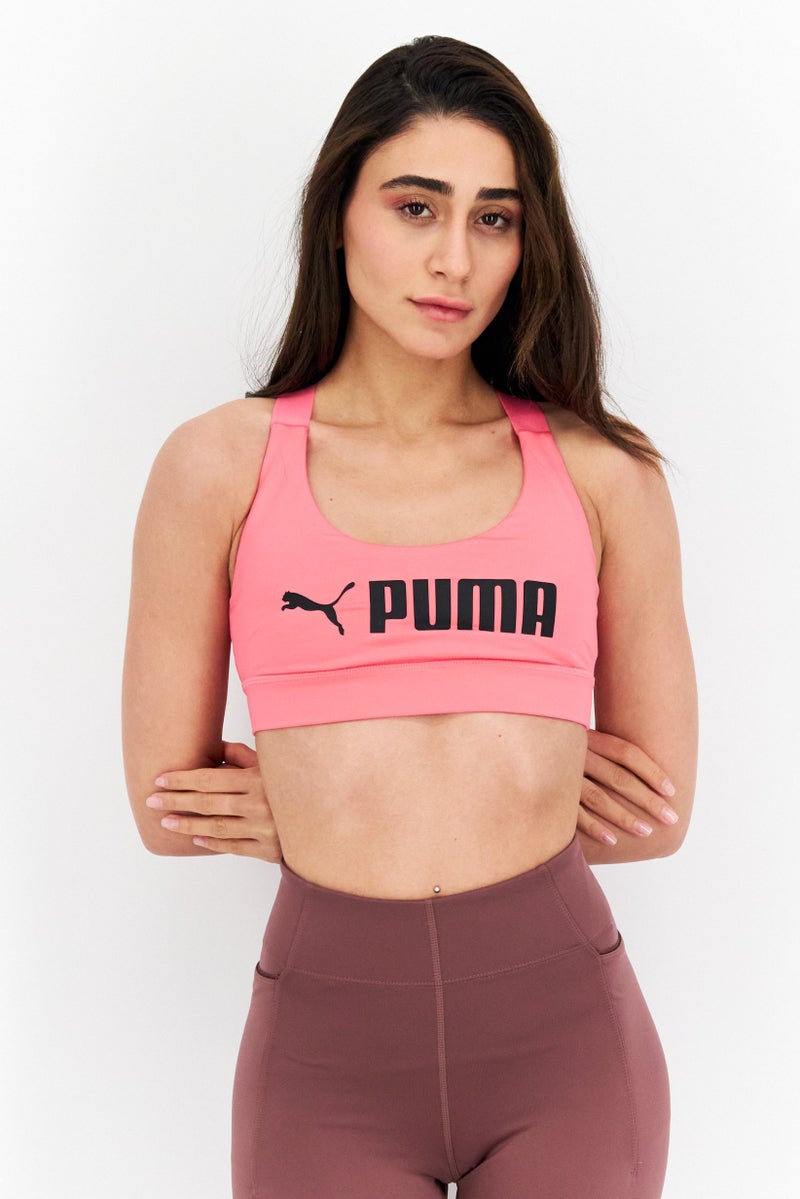 PUMA Women Brand Logo Lightly Padded Sports Bra, Sunset Pink - Image 1