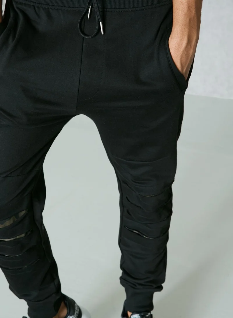 Seventy Five Ripped Knee Camo Sweatpants