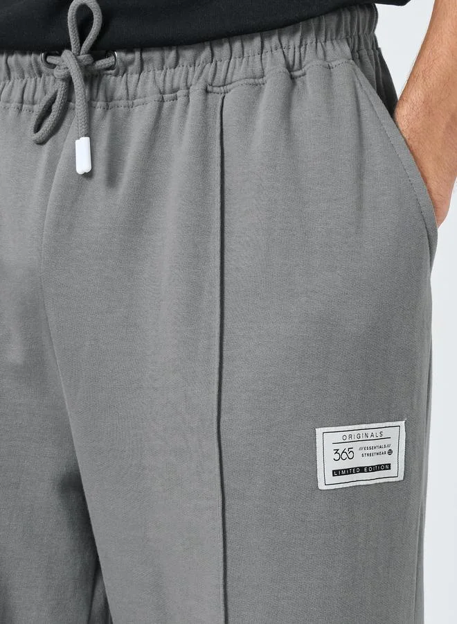 Styli Pintuck Wide Leg Terry Joggers with Badge Detail