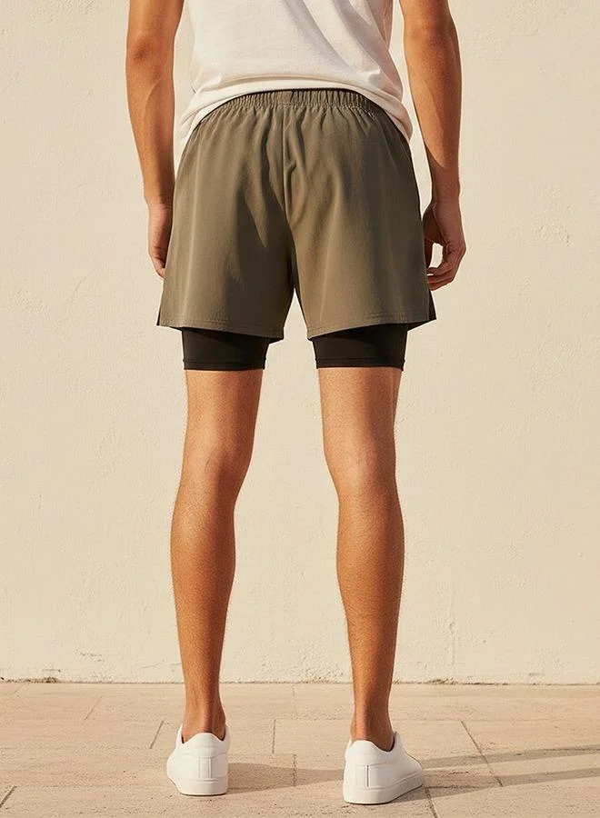 Kappa GREEN Kappa 2 Way Stretch Shorts with Inner Liner for Men | Best Price UAE