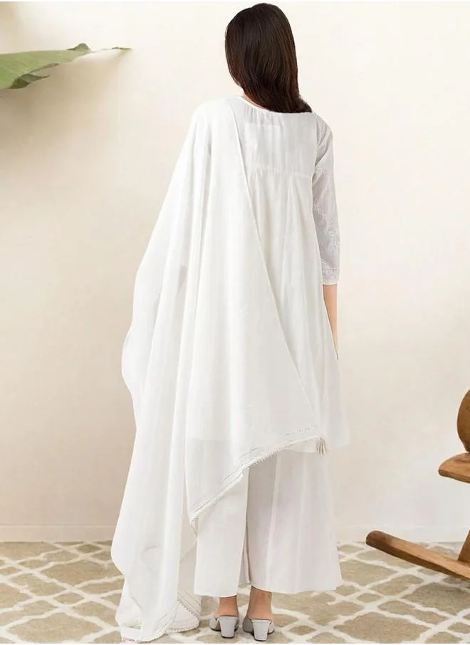 ISHIN Festive Women Off White Cotton Kurta Set with Embroidered pattern Tunic and Palazzo features a Round neckline and Three-Fourth Sleeve secured with Elastic closure and styled in Straight Fit ideal for Festive moments — exude elegance in every glance.
