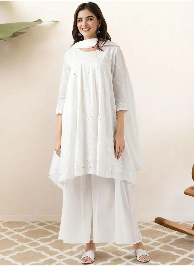 ISHIN Festive Women Off White Cotton Kurta Set with Embroidered pattern Tunic and Palazzo features a Round neckline and Three-Fourth Sleeve secured with Elastic closure and styled in Straight Fit ideal for Festive moments — exude elegance in every glance.