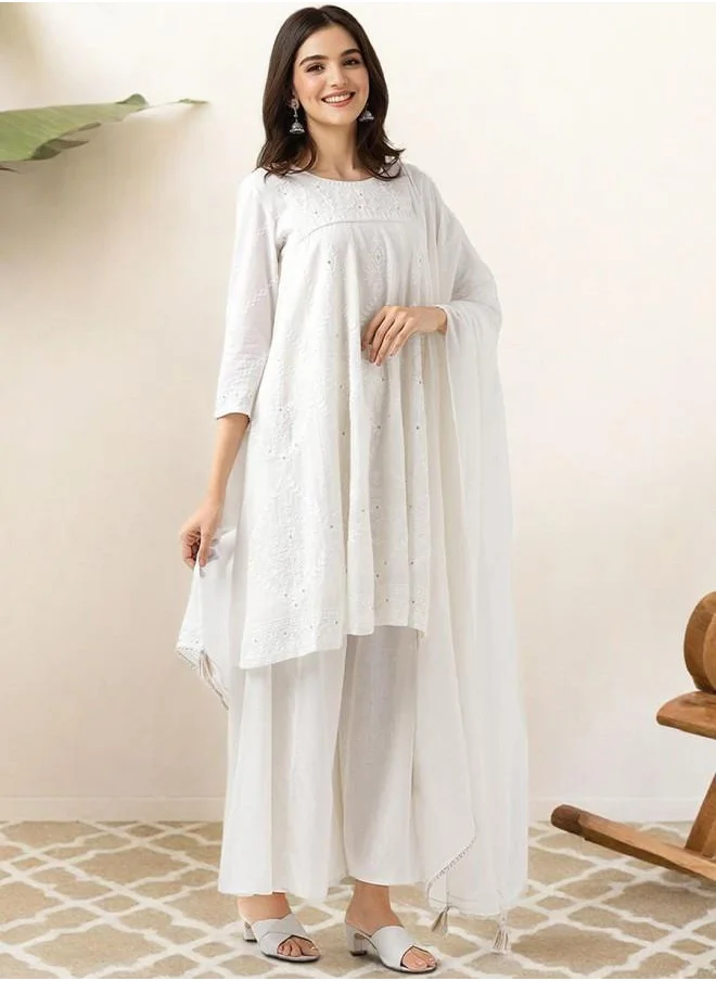 ISHIN Festive Women Off White Cotton Kurta Set with Embroidered pattern Tunic and Palazzo features a Round neckline and Three-Fourth Sleeve secured with Elastic closure and styled in Straight Fit ideal for Festive moments — exude elegance in every glance.