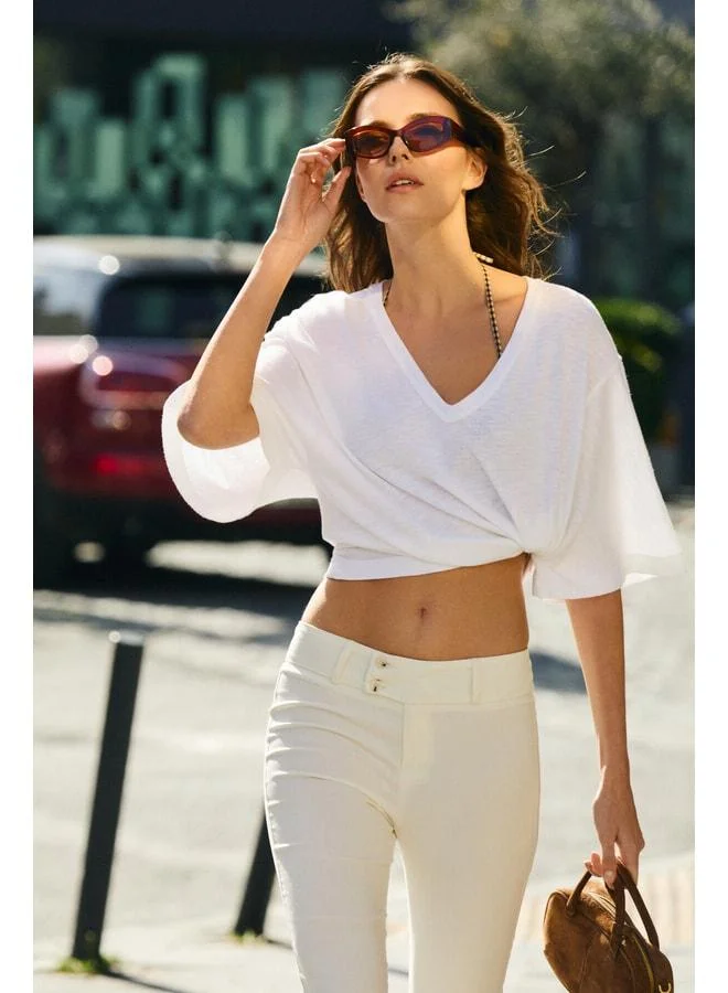 Grimelange VANDALA Women's 100% Organic Cotton Deep V-Neck Oversized White T-Shirt.