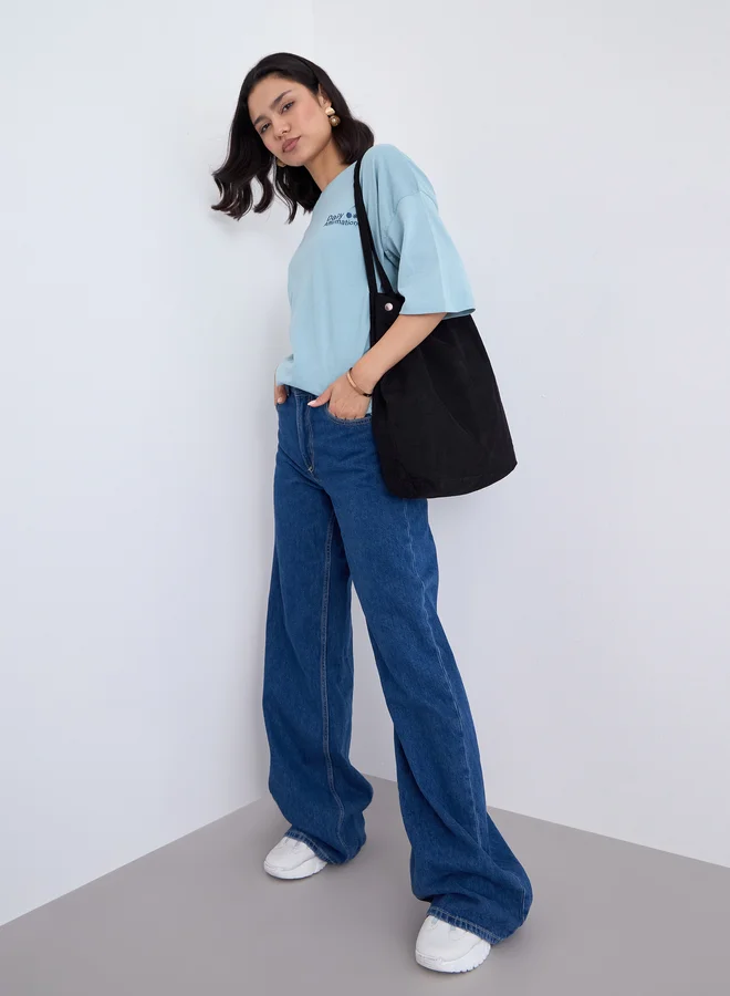 ستايلي تيشيرت واسع بطبعة كتابة