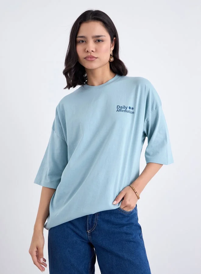Styli Blue Styli Blue Oversized Slogan Print T-Shirt for Women | Best Price UAE