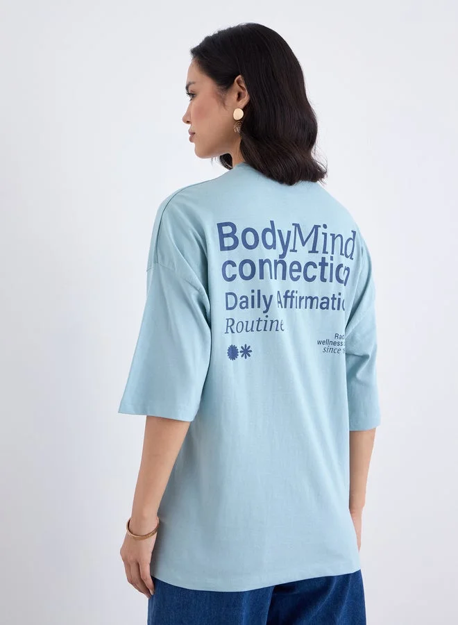 Styli Blue Styli Blue Oversized Slogan Print T-Shirt for Women | Best Price UAE