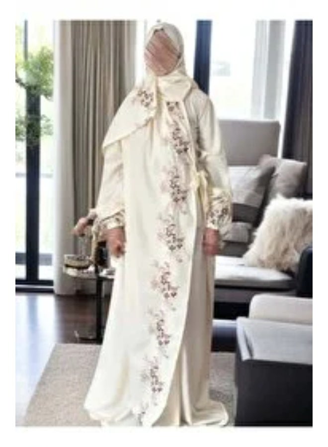 Women's prayer gown in an off-white shade; loose-fitting and comfortable, made from excellent, cool-to-the-touch fabric with a distinctive, modern design.