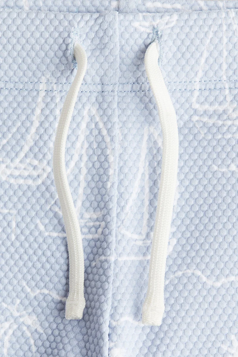 اتش اند ام شورت سباحة منقوش