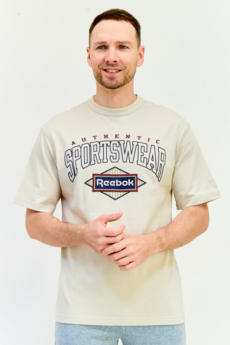 Reebok تي شيرت رياضي للرجال بأكمام قصيرة مناسب في الهواء الطلق، بيج - Image 1