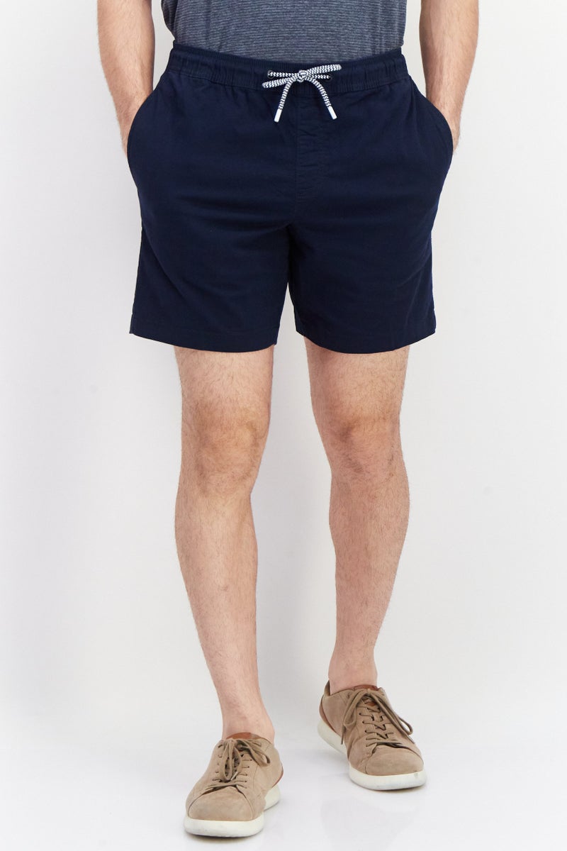 PERRY ELLIS شورتات تشينو صلبة للرجال بطول 9 إنش، كحلي - Image 1