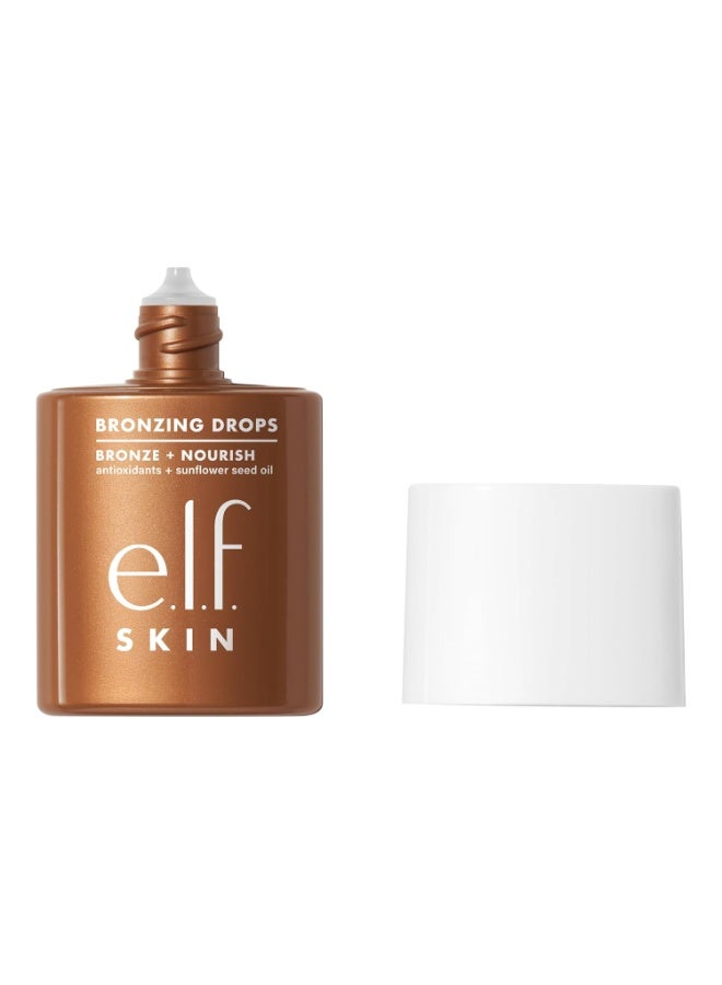 إلف e.l.f. SKIN قطرات التسمير (Bronzing Drops) - برونزر سائل للوجه والبشرة، يمنح إشراقة بلون الشمس، غني بفيتامين E، منتج نباتي ولم يُختبر على الحيوانات - درجة "الذهب الخالص" (Pure Gold) - 30 مل - Image 1