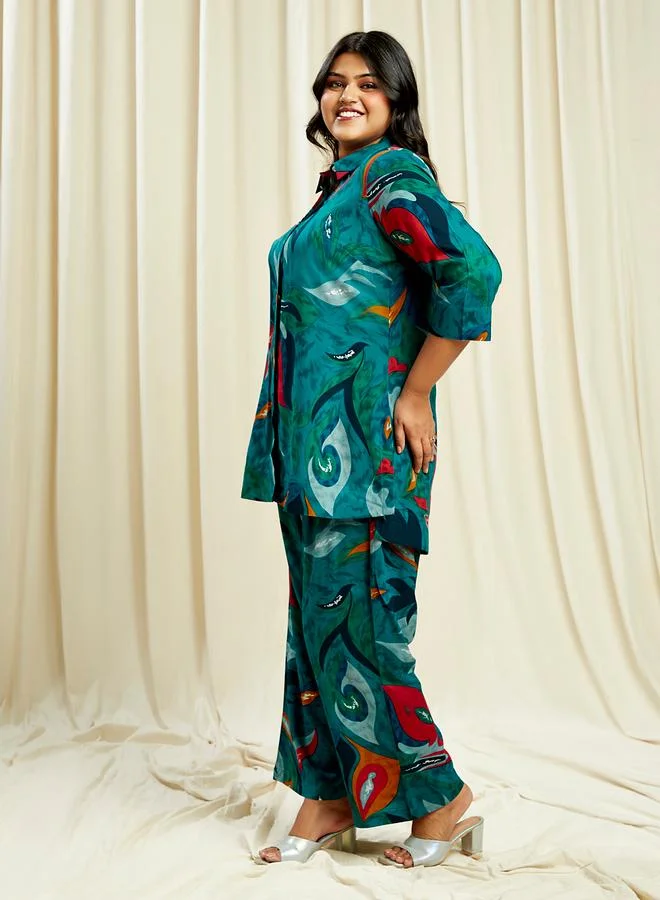 جلو باص طقم قميص وبنطال مطبوع بنقشة تجريدية بمقاس كبير